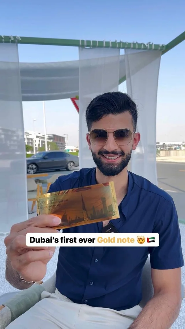 Rahul Sagar holding the Dubai gold note in the cover of his original Instagram reel